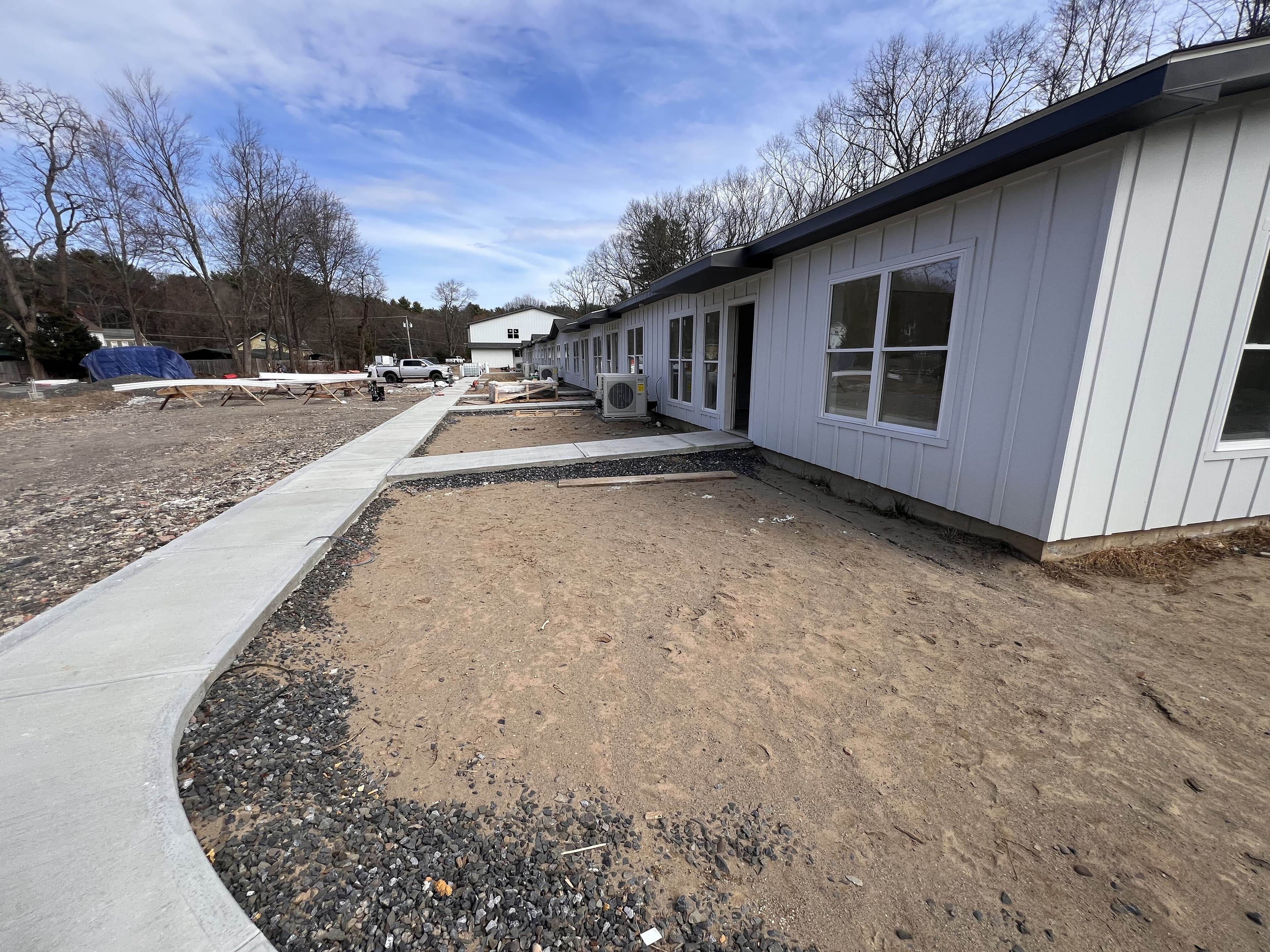 Current construction photo showing the Tillson Woods building and sidewalk.